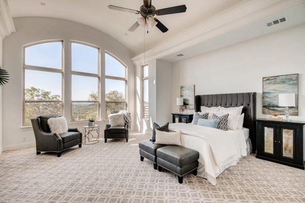 Master bedroom of a vacant home staged using furniture, art and accessories from our inventory.