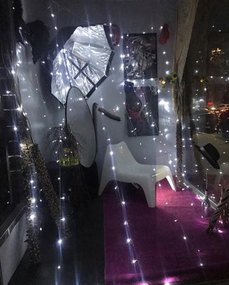 Front window of event space decorated in time for the holidays. Come and book your next event with us.