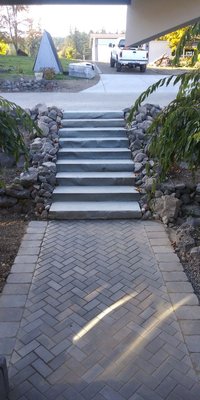 Natural stone steps and herring pattern paver installation