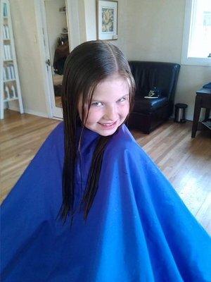 Lexi donating hair with a smile!