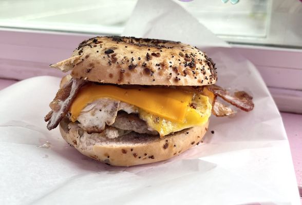 Fresh made Sausage & bacon breakfast sandwich on a every thing bagel #coffee #breakfast