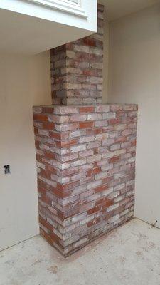 Faux finish to look like bricks.