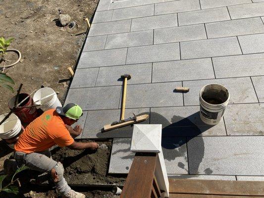 Stone patio, stone wall, retaining wall, block, concrete, masonry.