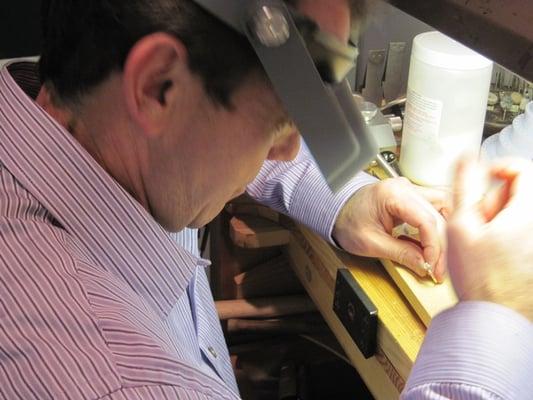 The owner, Michael Harris, working on a piece of jewelry.