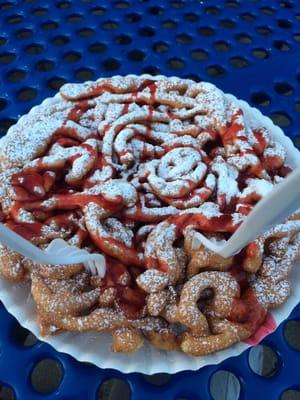 Funnel cake with strawberry syrup