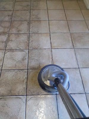 Steam cleaning a tile floor