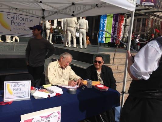 A wonderful day at Union Square San Francisco, our poet Emmanuel Williams writing a love poem.