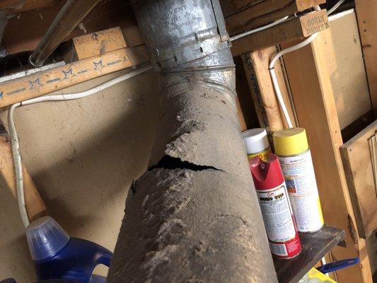 Large gaping hole in exhaust pipe leaking carbon monoxide in the home, completely missed after two visits.