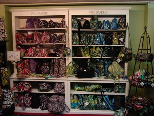 See and touch Vera Bradley handbags, accessories, travel, and leisure items.