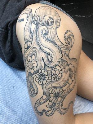 Black and grey octopus with flowers.