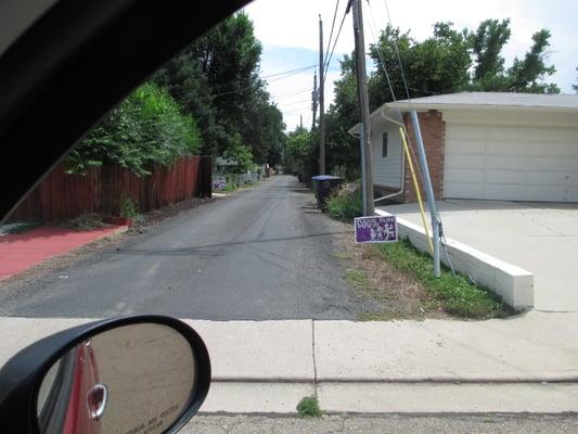 Alley entrance off 16th and Bowen--gate with the red bows