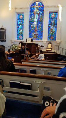 Music, under the beautiful stained glass