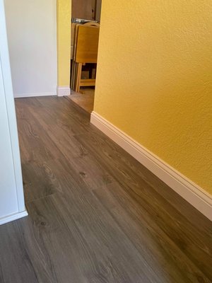 New flooring and look at the baseboard the owner made!