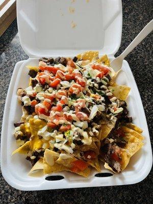 Nachos de asada. The chips were light and crispy and the meat was good.