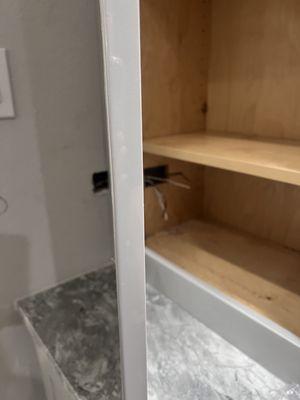 Shoddy craftsmanship placing an outlet in bathroom cabinet