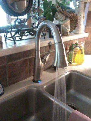 A Delta Touch Technology kitchen faucet installed.