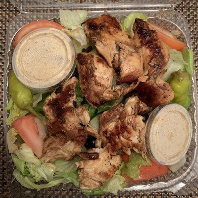 Grilled chicken salad (sans onions) Served with roll or pita Enough for a second meal