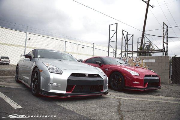 Nismo GT-R's hanging out together at the back of the shop.