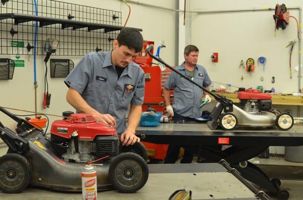 Howard Brothers Technicians Repairing Honda Lawn Mowers