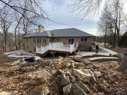 Huge landscape project with patio,walk ways, and sitting walls, all tied together to a new beautiful deck!