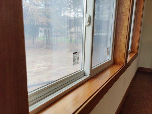 stained and sealed window frames look amazing compared to raw wood.