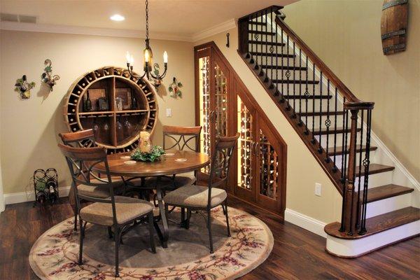 Custom made wine storage cabinet. Brand new cherry stair case with wrought iron baluster.