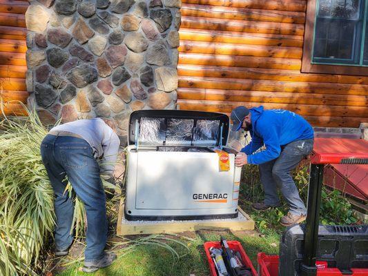 Hubby  cutting back decorative grass and Jared