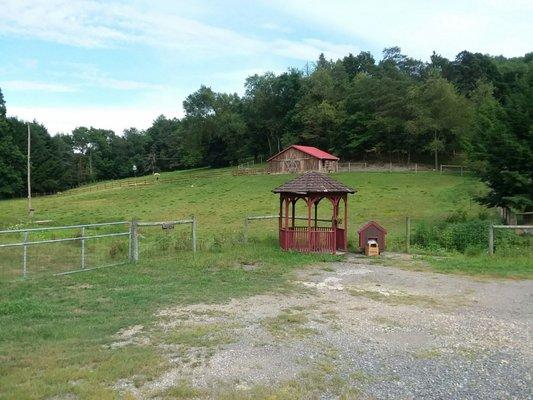 Quaint small gazebo near entrance.