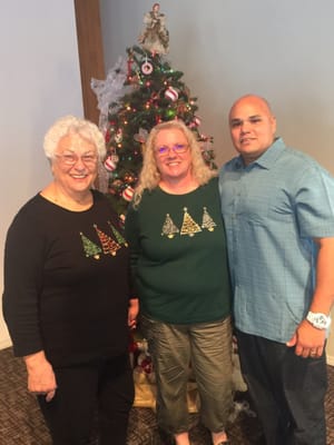 Associate pastor Creed Lundsford with two of his admirers.