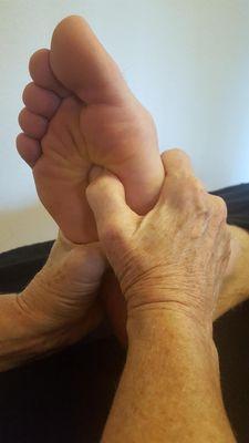 Applying pressure to the solar plexus in Foot Reflexology