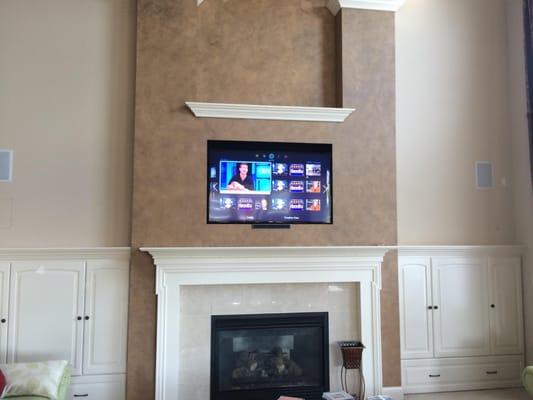 Beautiful inset tv over the fireplace!