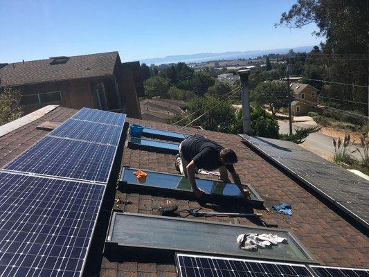 Hard at work. We clean skylights and solar panels.