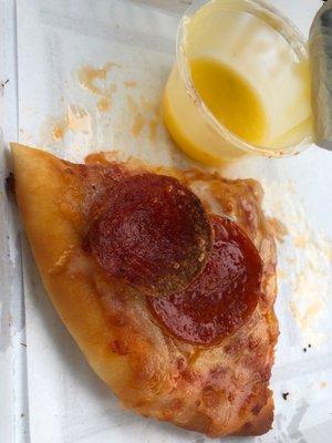 Personal pan pepperoni pizza with a side of garlic sauce