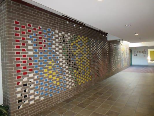 The Celebration of Life tile wall inside the Dr. Robert M. Fales Hospice Pavilion in Wilmington, NC, serves as a tribute and ...