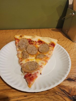 Slice of sausage pizza