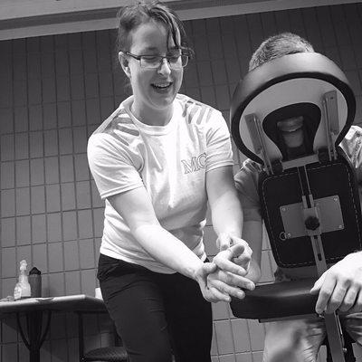 At a mobile chair massage event in a community college.