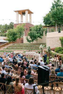 A ceremony taking place in front of our lush ivy wall!