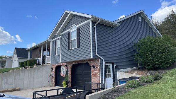 New siding, roof and shutters after April 1st Hailstorm. House is looking beautiful again.