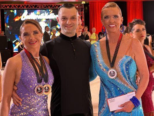 Kyrylo Myshakova and his students Christine and Melanie at competition.