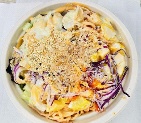 Poke Bowl with kani, veggies with mixed spring greens