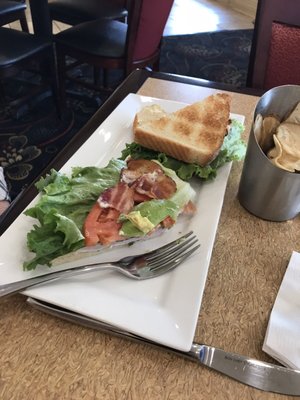 BLT sandwich with a side of their homemade chips. With a glass of Pinot Grigio.