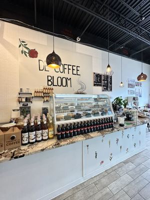 Coffee bar, dessert case, and register.