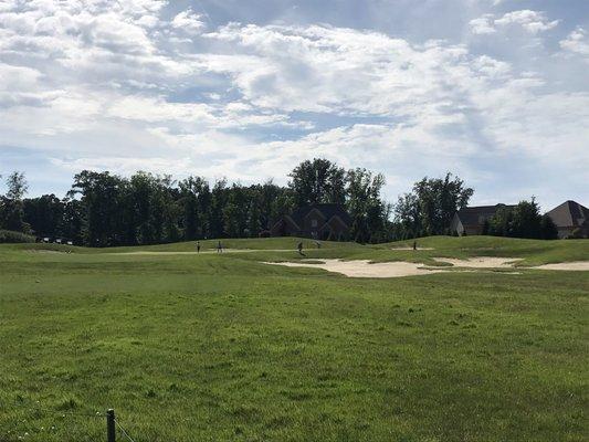 Five slow golfers all over the green!