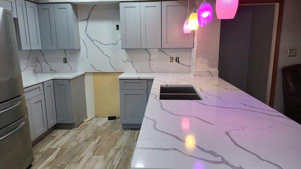 Along with the light gray shaker cabinets