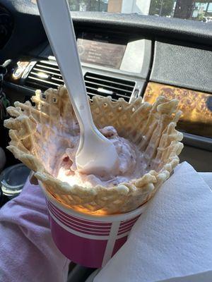 Strawberry ice cream in a waffle cup