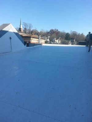 This roofing system is heat welded and insulation board used for moisture barrier, then fully glued down to help with wind re...