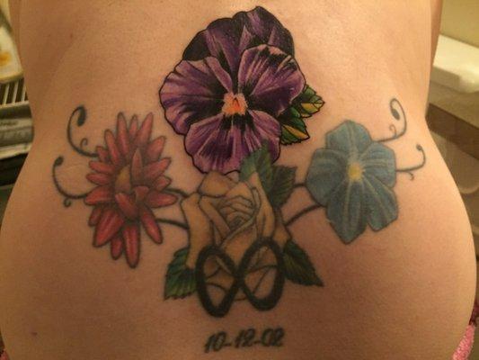 Violet flower added to an older tattoo. Gorgeous!!