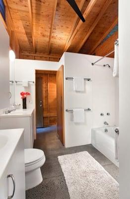 Bathrooms with Corian Walls and Countertops