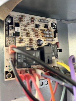 Defrost board with burn marks near the resistors