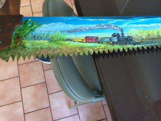 Custom painted saw
 by artist Carl Hayes